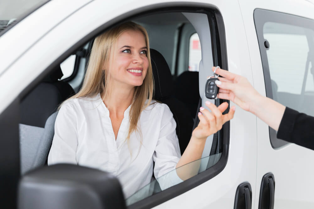 Locksmith handing over car keys